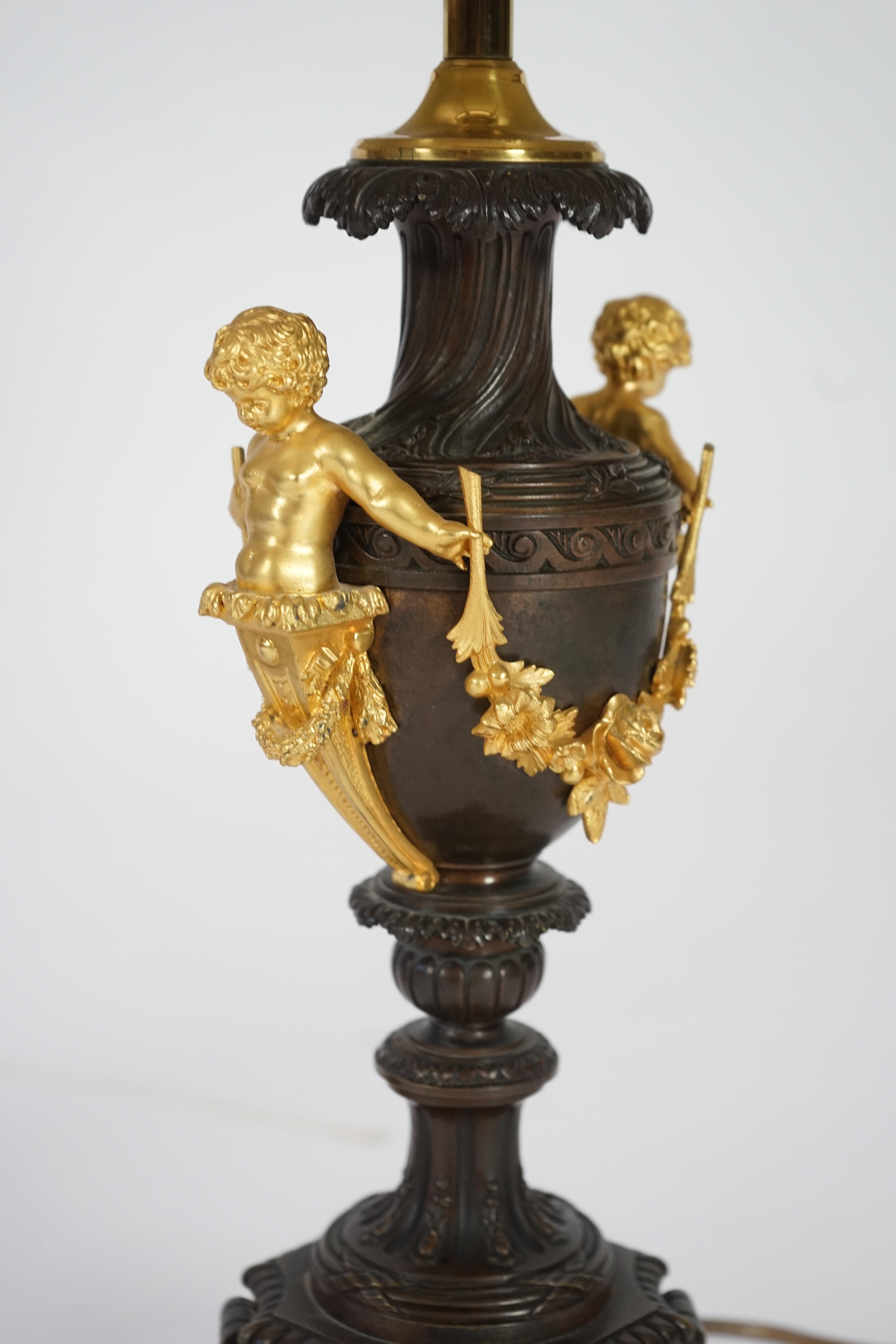 A pair of 19th century French bronze and ormolu table lamps